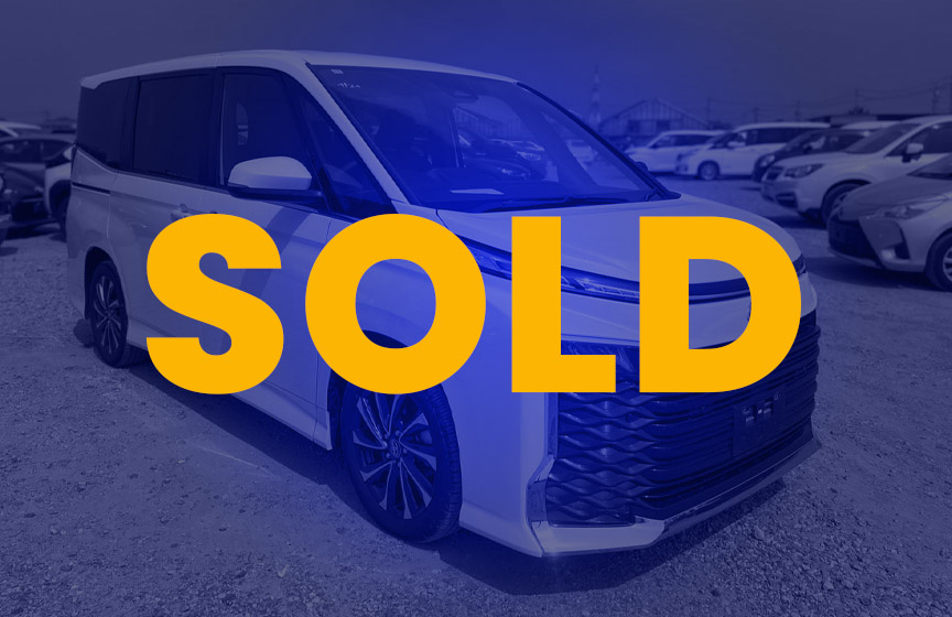 2024 Toyota Voxy in white color parked at UFS Lanka stockyard, showcasing modern front grille and sleek design